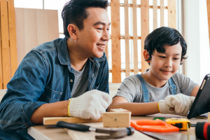 father and son doing diy projects in a workshop space